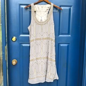 Grey fossil dress with bronze beading.